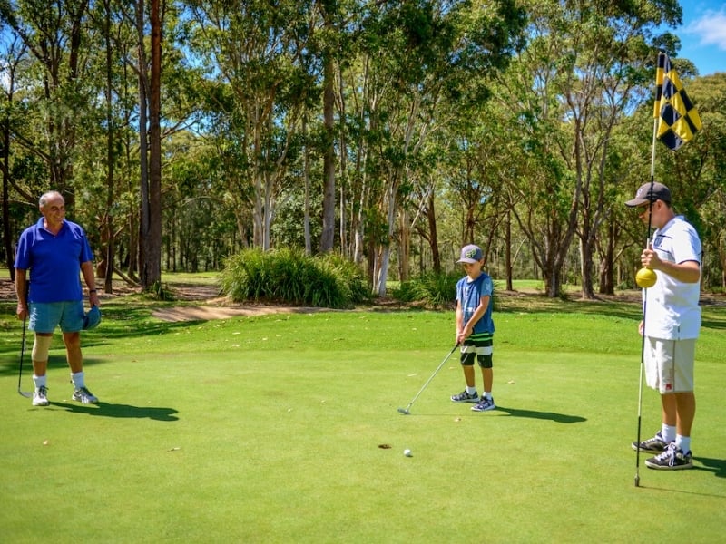 Family playing golf at the Sussex Inlet Golf Club NSW