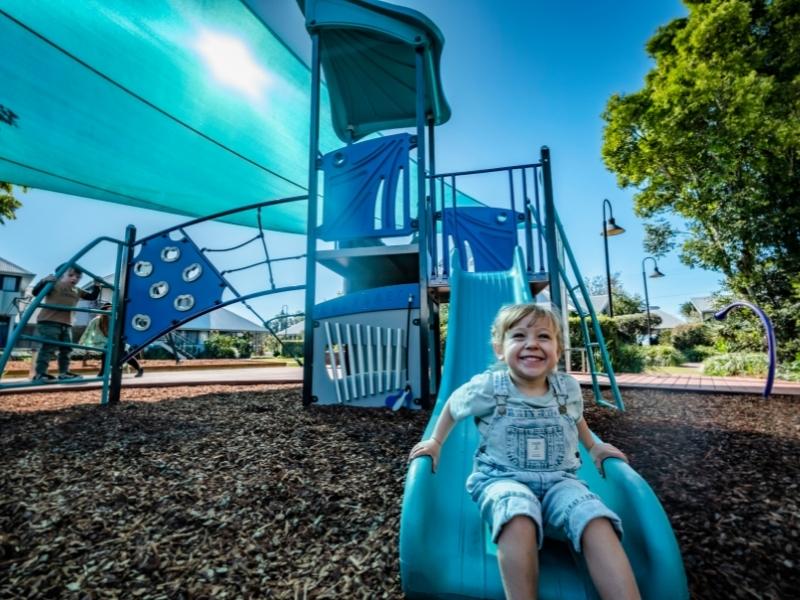 Children playing on the play equipment at Riverside Holiday Resort Urunga 800x600